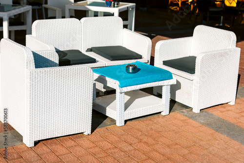 Luxury terrace with white chairs . Outdoor restaurant furniture