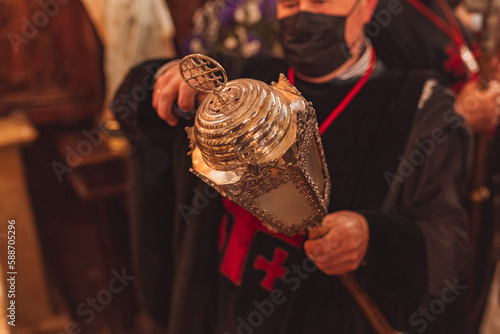 Картината върху платно Penitent lighting a lantern