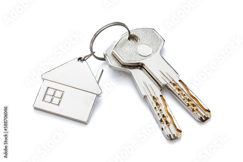 Keychain in the form of a house with two keys. Close-up. Highlighted on a white background.