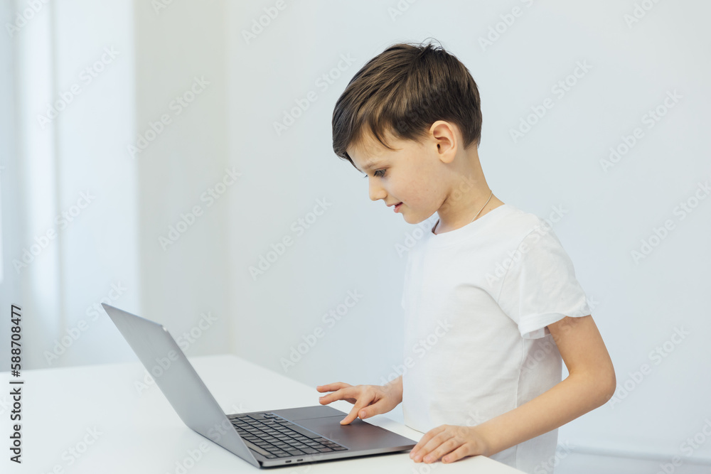programmer at a computer in a classroom at school at a laptop programmer at a computer in a classroom at school at a laptop