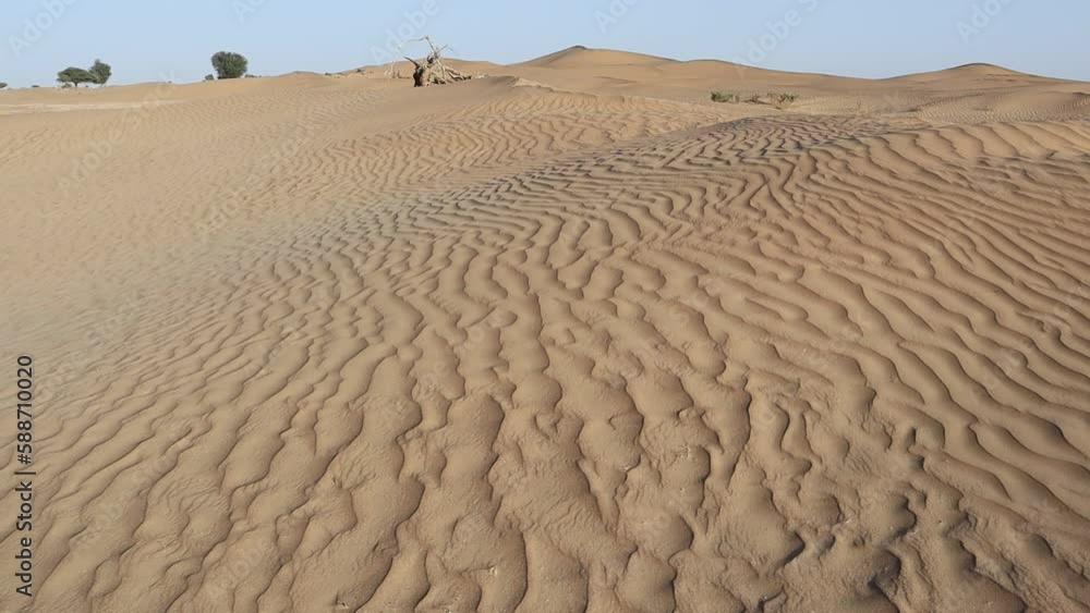 Aerial view of beautiful brown sand dunes in a sunny desert Aerial view of beautiful brown sand dunes in a sunny desert
