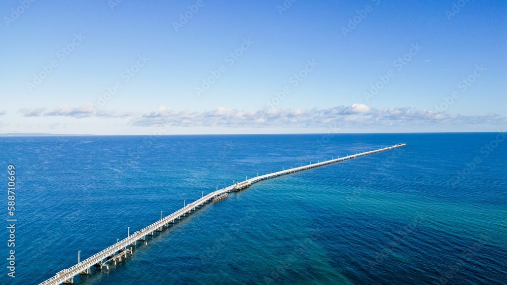 Aerial view of the Busselton Jetty on a sunny day in Busselton, Australia
