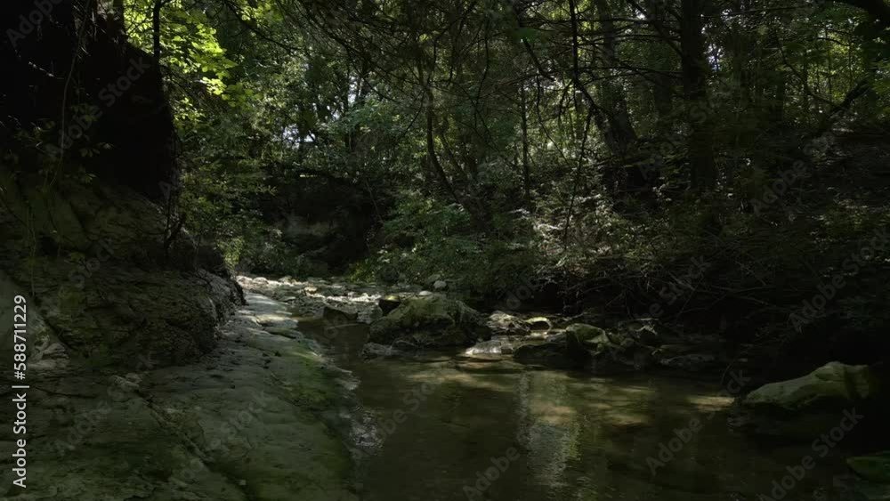 Beautiful view of woods in Lost Creek in Allen TX with river, rocks and light falling from trees Beautiful view of woods in Lost Creek in Allen TX with river, rocks and light falling from trees
