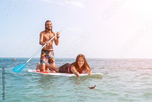 Photography Sea woman and man on sup