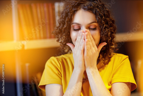 A woman inhales essential oil