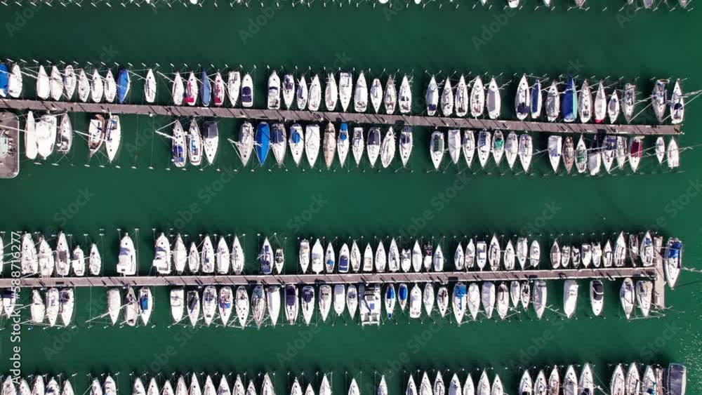 Aerial top down of boat anchored in parallel row in harbor, background Aerial top down of boat anchored in parallel row in harbor, background