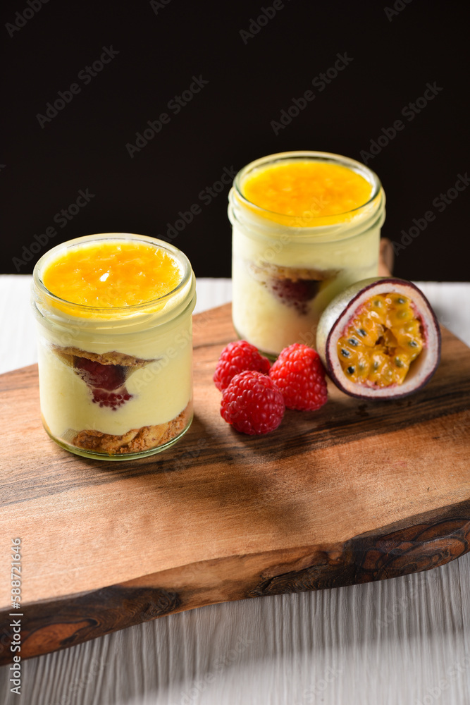 Vegan Panna Cotta sweet dessert with passion fruit, garnish with fresh mint leaf. Homemade recipe, dark background Vegan Panna Cotta sweet dessert with passion fruit, garnish with fresh mint leaf. Homemade recipe, dark background