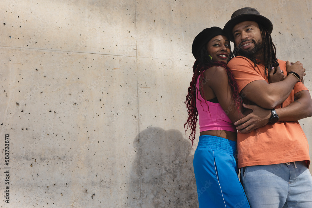 Portrait of African-American couple embracing each other.