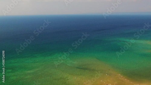 Lake Michigan drone backward movement Up North beautiful aqua water summer day windy photo