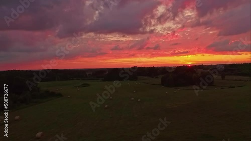 Wallpaper Mural Colorful sunset over a green countryside landscape - aerial view Torontodigital.ca