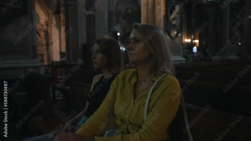 Family in a large Catholic cathedral. Family in a large Catholic cathedral.
