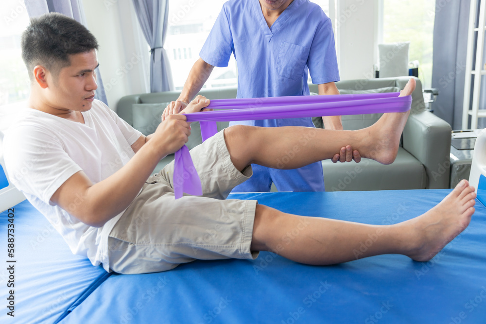 Fototapeta premium Physiotherapist working with patients in clinic,