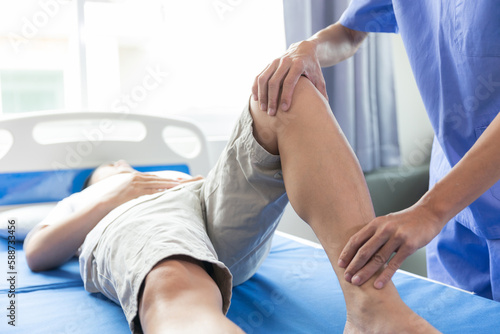 Physiotherapist working with patients in clinic,