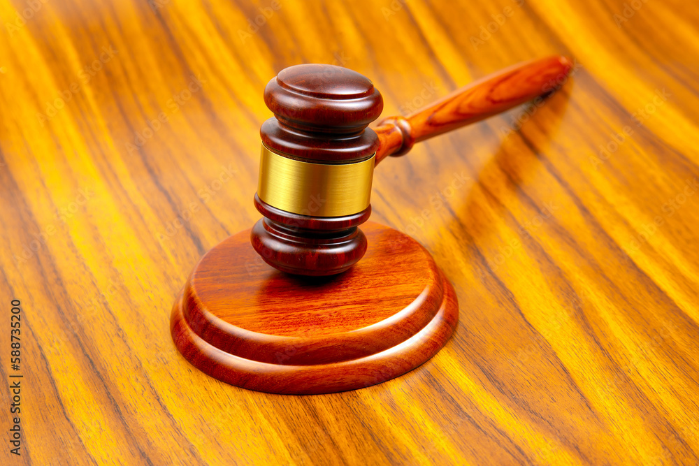 wooden hammer for auctions, bidding and judicial law. symbol of justice and verdict wooden hammer for auctions, bidding and judicial law. symbol of justice and verdict