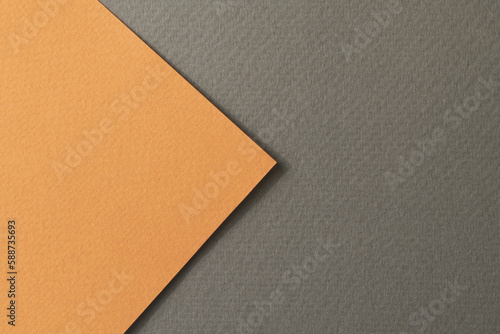 Rough kraft paper background, paper texture black orange colors. Mockup with copy space for text