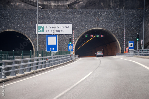 Tunnel entrance. Tunel do Marão is a road tunnel located in Portugal that connects Amarante to Vila Real, crossing the Serra do Marão. - Concept of hope, the light at the end of the tunnel. photo