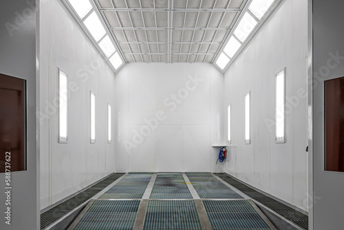 Fototapeta Naklejka Na Ścianę i Meble -  Automotive paint shop.Spray paint cabinet in a car repair station. Auto service concept. High-quality painting of vehicles in a room with a filter and good light.