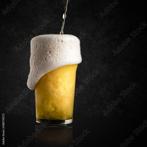 glass of beer on black