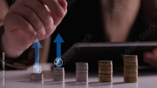 Finance and business concept. Investment graph and rows growth of coins on table. Concept of investing and financial management. 4K