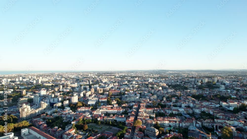 Flyover aerial view of Porto, Portugal crowded cityscape with horizon in the distance, drone Flyover aerial view of Porto, Portugal crowded cityscape with horizon in the distance, drone