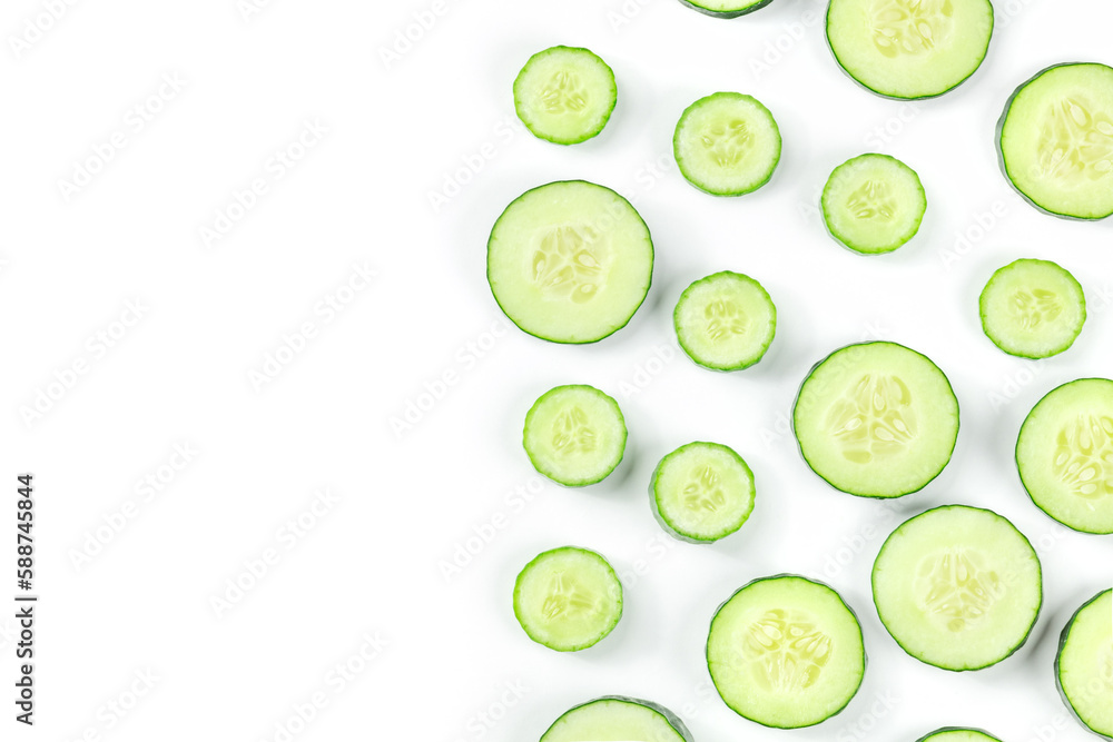 Fresh cucumber slices on a white background, shot from above. Healthy organic food pattern with copy space Fresh cucumber slices on a white background, shot from above. Healthy organic food pattern with copy space