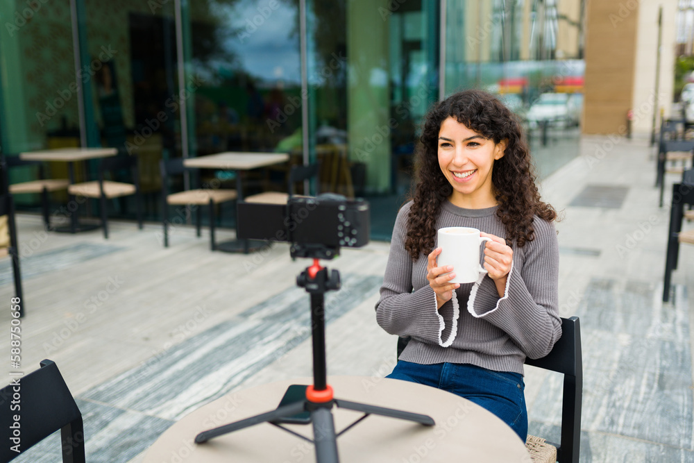 Smiling woman and blogger filming in the coffee shop Smiling woman and blogger filming in the coffee shop