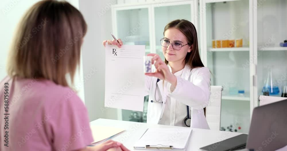Medicine doctor gives list of prescriptions to patient and pills closeup. Health care medicine appointment treatment or legal pharmacy Medicine doctor gives list of prescriptions to patient and pills closeup. Health care medicine appointment treatment or legal pharmacy