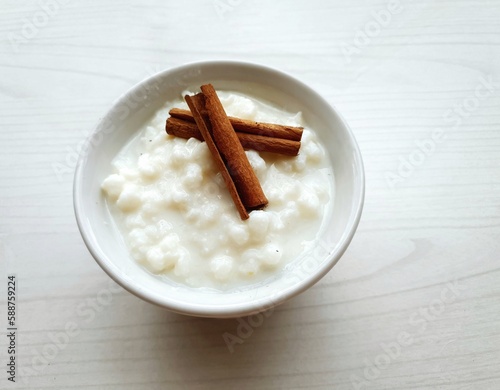  corn hominy in white bowl with cinnamon