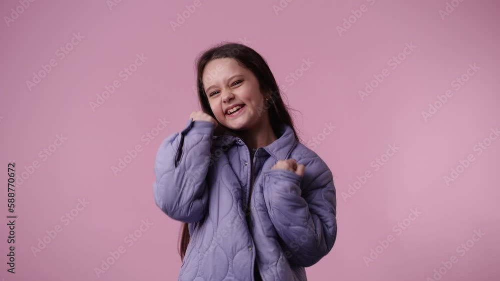 4k video of one girl posing for a video on pink background. 4k video of one girl posing for a video on pink background.
