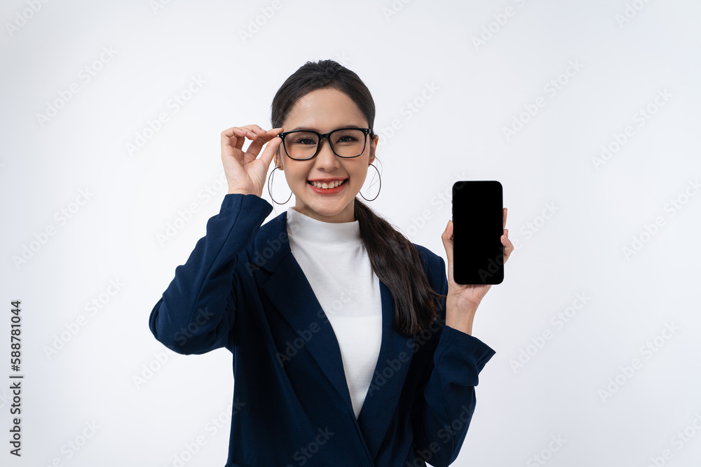 Happy young Asian businesswoman in a glasses with smile showing blank screen smartphone isolated on white background. Happy young Asian businesswoman in a glasses with smile showing blank screen smartphone isolated on white background.