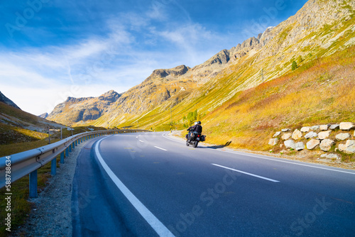 A team of motorcyclists travels the beautiful roads in the mountains. The road and the turns. Traveling on a motorcycle. Recreation and active life.