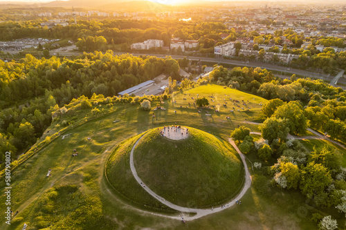 Aerial view of the Krakus Mound with sunset view of the historical part of Krakow old town, Poland.