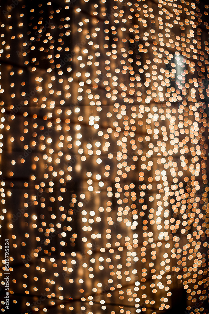 Naklejka premium Golden christmas lights in background.