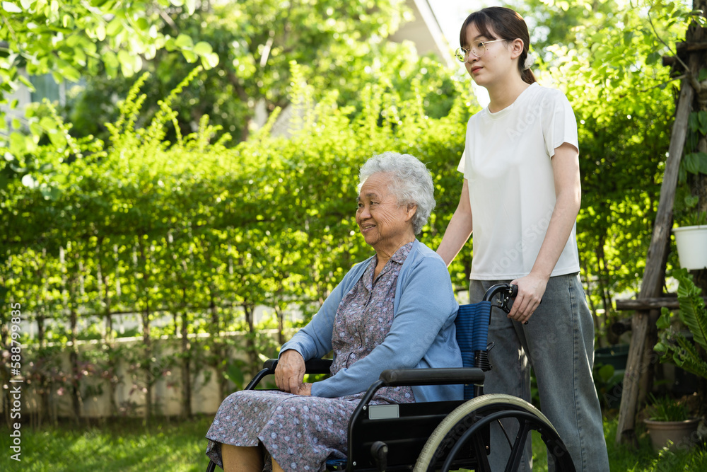 caregiver help and care Asian senior woman patient sitting on wheelchair at nursing hospital ward, healthy strong medical concept. caregiver help and care Asian senior woman patient sitting on wheelchair at nursing hospital ward, healthy strong medical concept.