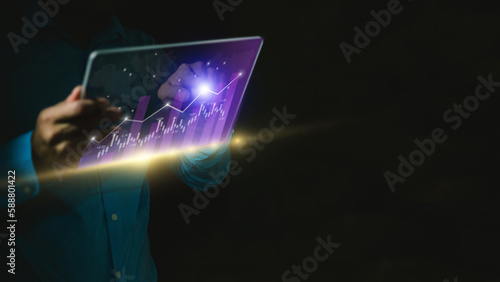 Businessman trading online stock market on teblet screen, digital investment concept