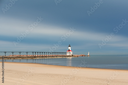 Fototapeta Naklejka Na Ścianę i Meble -  Michigan City Lighthouse and beach with storm clouds approaching.  Michigan city, Indiana, USA.