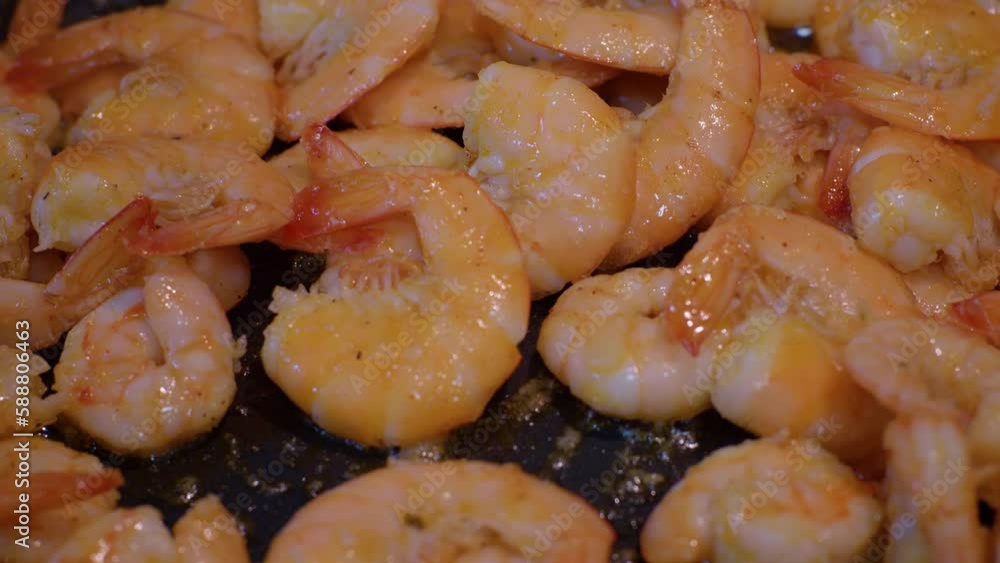 Close-up shot of shrimps getting cooked in a pan with butter. Sea food being prepared frying in hot oil or butter. Cousine concept ideas. Close-up shot of shrimps getting cooked in a pan with butter. Sea food being prepared frying in hot oil or butter. Cousine concept ideas.