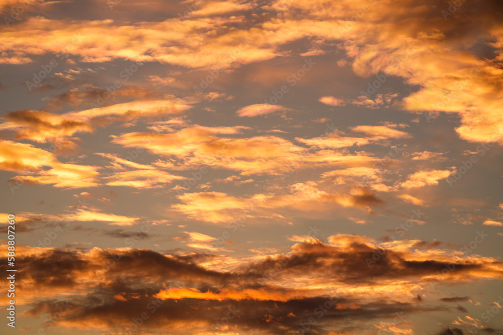 Orange sunset sky. Beautiful sky landscape with spectacular clouds. Wallpaper photo.