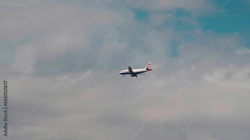 Plane flying going along the clouds gaining altitude. Shot of a Boing flying in the high sky. Plane flying going along the clouds gaining altitude. Shot of a Boing flying in the high sky.