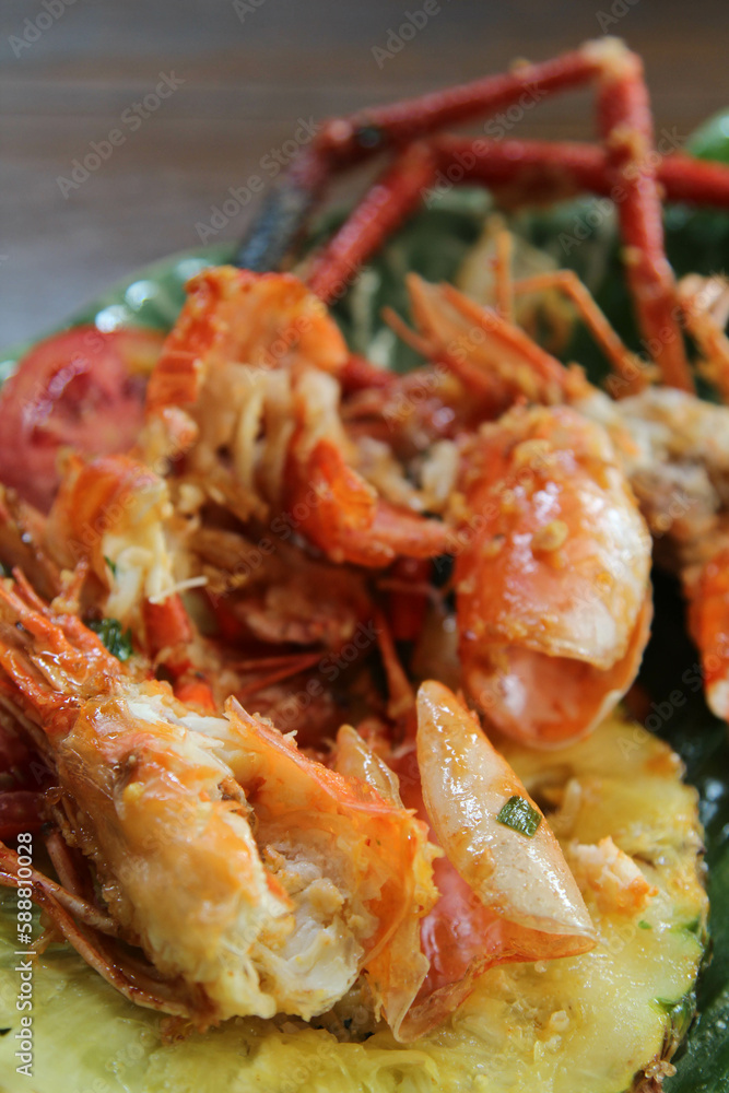 Shrimp shell and head waste after eating full on banana leaf on ceramic plate Shrimp shell and head waste after eating full on banana leaf on ceramic plate