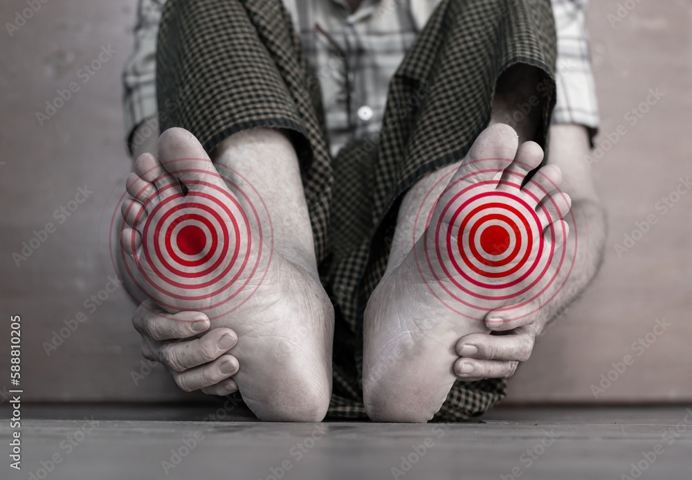 Tingling and burning sensation in foot of Asian man. Foot pain. Sensory