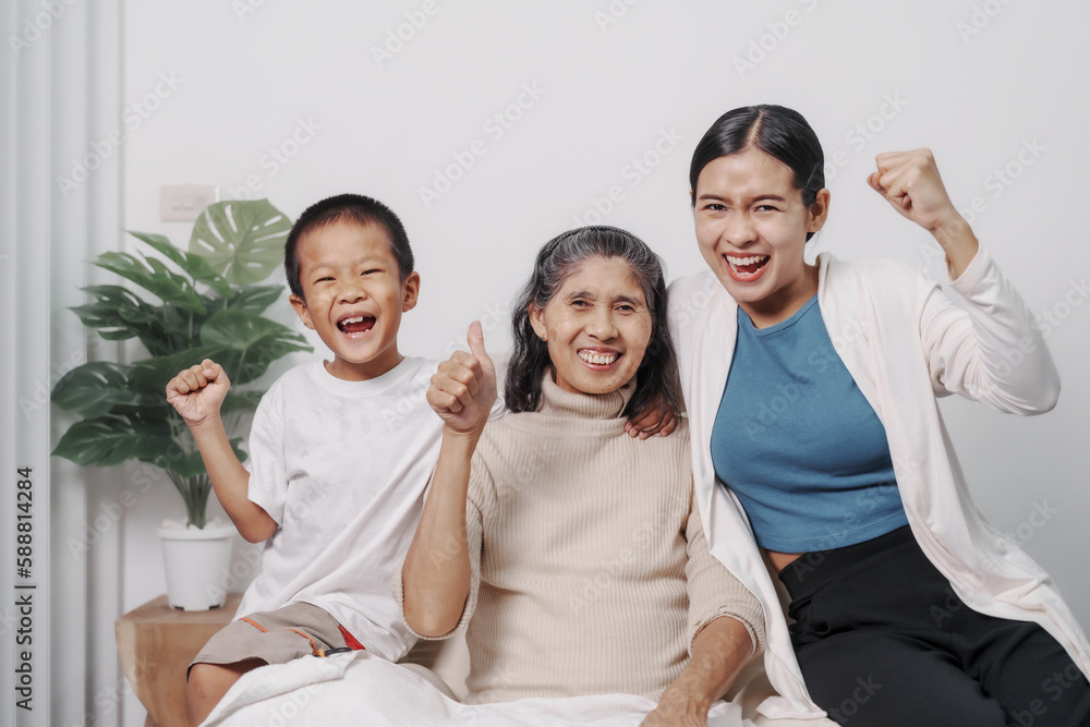 My grandmother and daughter and grandson hugged lovingly while sitting on the sofa with care and warmth, love, valentine, family, care. My grandmother and daughter and grandson hugged lovingly while sitting on the sofa with care and warmth, love, valentine, family, care.