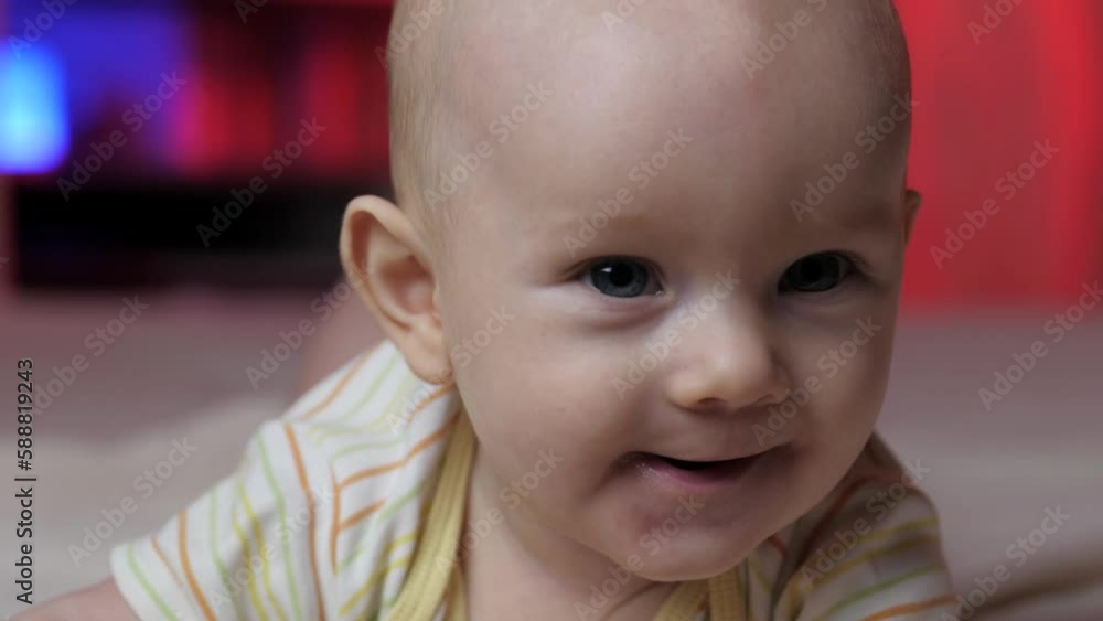 Happy infant. Newborn close-up. Happy little baby funny smiling. Early baby development. Happy infant. Newborn close-up. Happy little baby funny smiling. Early baby development.