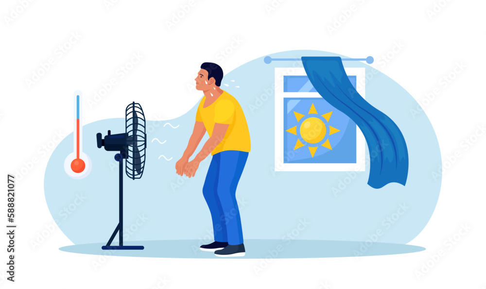 Man standing, chilling under cooling fan, under blowing air at home