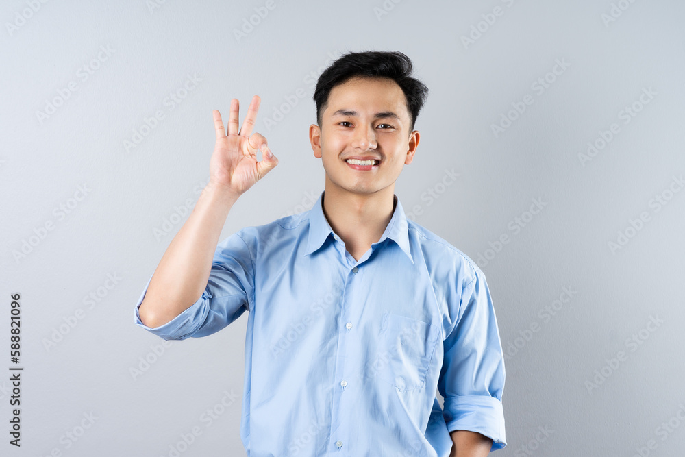 image of young businessman male on gray background image of young businessman male on gray background