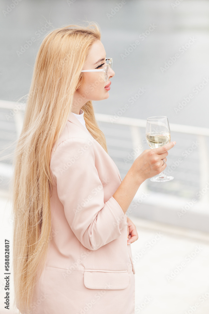 Woman at party with friends, wine for success at restaurant and drinks at social event. Woman with glass at birthday dinner
