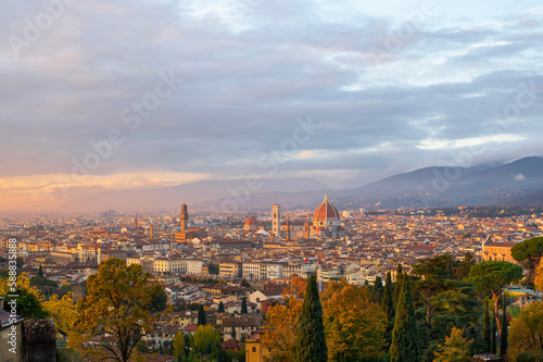 View of Florence Cathedral (Cattedrale di Santa Maria del Fiore) and rest of Florence from Michelangelo plaza at sunset. Panoramic view of Florence, Tuscany, Italy © Lizaveta