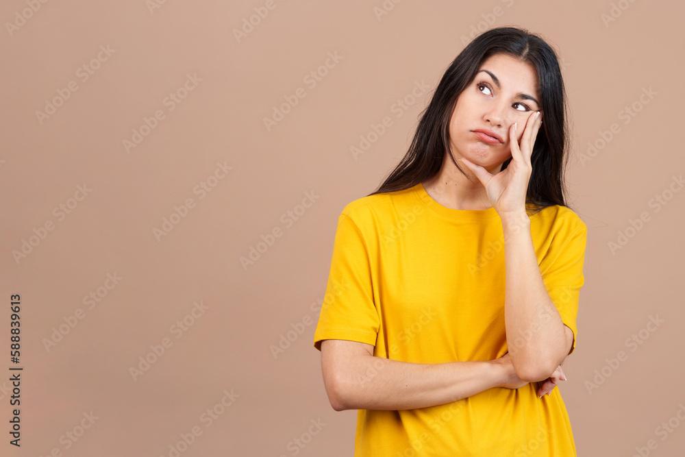 Bored caucasian woman standing and looking up Bored caucasian woman standing and looking up