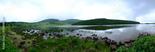  Calm Lake with Green Hills in the Distance