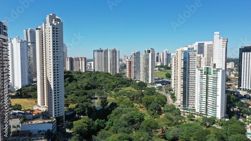 Wonderful panoramic view of Flamboyant Park with lakes and tropical trees surrounded by modern residential apartments in Goiania, Goias, Brazil in April, 2023.  © MARCIA COBAR